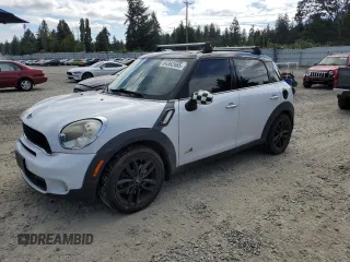 2011 MINI Countryman S with VIN WMWZC5C55BWH99762, listed as a Copart auction lot 64362465 with 67,724 mi miles and Salvage title. Bid and sale history available at DreamBid. Image 1.