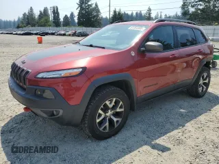 2015 Jeep Cherokee Trailhawk z VIN 1C4PJMBSXFW661218, wystawiony jako Copart lot #61364895 z przebiegiem 139 200 mil mil oraz Szkoda całkowita • Salvage title. Historia ofert i sprzedaży dostępna na DreamBid. Obrazek 1.
