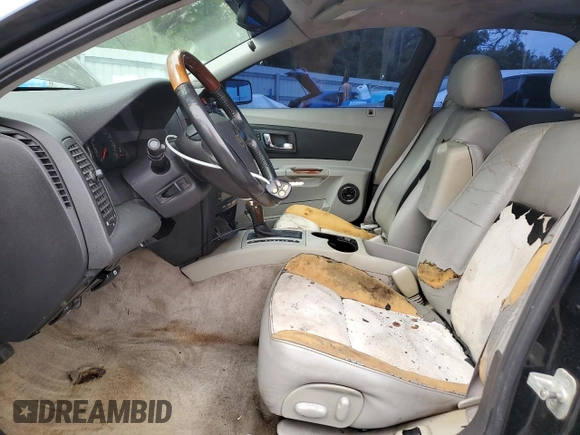 2004 Cadillac CTS with VIN 1G6DM577X40105370, listed as a Copart auction lot 58203715 with 135,391 mi miles and Salvage title. Bid and sale history available at DreamBid. Image 7.