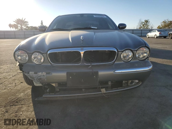 2004 Jaguar XJ with VIN SAJWA71C74SG20299, listed as a Copart auction lot 79469504 with 78,134 mi miles and Salvage Title. Bid and sale history available at carsss.com. Image 5.