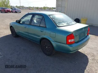 2002 Mazda Protege DX z VIN JM1BJ225021606891, wystawiony jako IAAI lot #42011997 z przebiegiem 134 758 mil mil oraz . Historia ofert i sprzedaży dostępna na DreamBid. Obrazek 3.