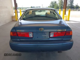2000 Toyota Camry CE z VIN JT2BG22KXY0406984, wystawiony jako IAAI lot #42344436 z przebiegiem 234 729 mil mil oraz . Historia ofert i sprzedaży dostępna na DreamBid. Obrazek 16.