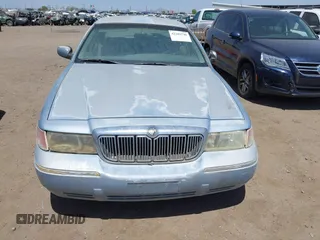 2000 Mercury Grand Marquis LS z VIN 2MEFM75W8YX660478, wystawiony jako IAAI lot #42289748 z przebiegiem 237 860 mil mil oraz . Historia ofert i sprzedaży dostępna na DreamBid. Obrazek 6.