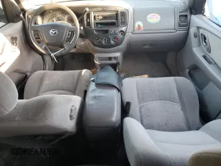 2002 Mazda Tribute LX with VIN 4F2YU09182KM64860, listed as a Copart auction lot 77391824 with 207,965 mi miles and Salvage Title. Bid and sale history available at DreamBid. Image 8.
