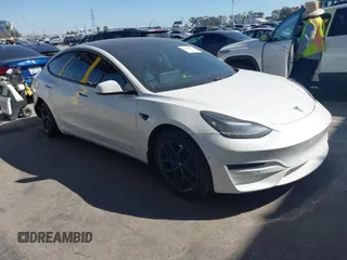 2020 Tesla Model 3 Standard Range Plus with VIN 5YJ3E1EA1LF659765, listed as a IAAI auction lot 41834411 with 42,433 mi miles and . Bid and sale history available at carsss.com. Image 1.