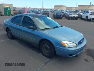2005 Ford Taurus SE with VIN 1FAFP53275A285724, listed as a IAAI auction lot 40549174 with 127,609 mi miles. Bid and sale history available at carsss.com. Image 1.