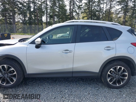 2016 Mazda CX-5 Grand Touring with VIN JM3KE4DYXG0647802, listed as a IAAI auction lot 41996854 with 85,774 mi miles. Bid and sale history available at carsss.com. Image 14.