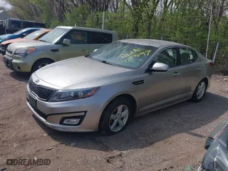 2014 Kia Optima LX with VIN KNAGM4A71E5493247, listed as a IAAI auction lot 42035797 with 153,811 mi miles. Bid and sale history available at carsss.com. Image 2.