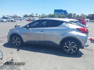 2018 Toyota C-HR XLE z VIN NMTKHMBX2JR057798, wystawiony jako IAAI lot #42327724 z przebiegiem 115 715 mil mil oraz . Historia ofert i sprzedaży dostępna na DreamBid. Obrazek 13.
