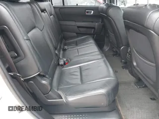 2014 Honda Pilot Touring with VIN 5FNYF4H91EB041614, listed as a IAAI auction lot 42050405 with 158,236 mi miles and . Bid and sale history available at DreamBid. Image 8.