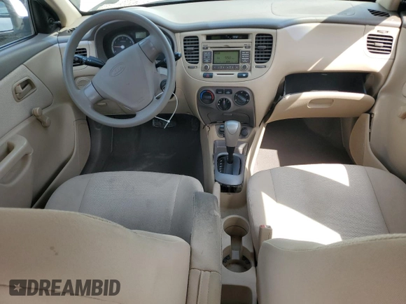 2009 Kia Rio LX with VIN KNADE223896456292, listed as a Copart auction lot 54990605 with 61,220 mi miles and Salvage Title. Bid and sale history available at DreamBid. Image 8.