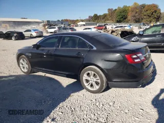 2015 Ford Taurus SEL with VIN 1FAHP2E90FG148821, listed as a Copart auction lot 77557384 with 141,514 mi miles and Salvage Title. Bid and sale history available at DreamBid. Image 2.