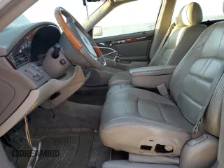 2001 Cadillac DeVille DHS z VIN 1G6KE57Y31U229255, wystawiony jako Copart lot #75101214 z przebiegiem 141 187 mil mil oraz Czysty tytuł • Clean title. Historia ofert i sprzedaży dostępna na DreamBid. Obrazek 7.
