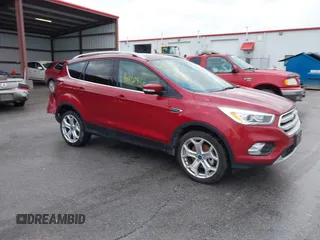 2019 Ford Escape Titanium with VIN 1FMCU9J99KUA18880, listed as a IAAI auction lot 40830436 with 117,499 mi miles and . Bid and sale history available at DreamBid. Image 1.