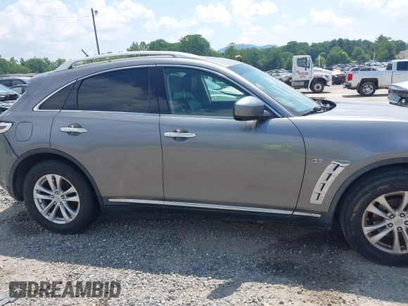 2014 Infiniti QX70 with VIN JN8CS1MW5EM411653, listed as a IAAI auction lot 42690935 with 110,806 mi miles and . Bid and sale history available at DreamBid. Image 13.