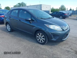 2011 Ford Fiesta SE z VIN 3FADP4BJ5BM219052, wystawiony jako IAAI lot #42297403 z przebiegiem 108 302 mil mil oraz . Historia ofert i sprzedaży dostępna na DreamBid. Obrazek 1.
