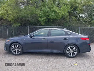 2019 Kia Optima LX z VIN 5XXGT4L32KG298796, wystawiony jako IAAI lot #42266827 z przebiegiem 89 841 mil mil oraz . Historia ofert i sprzedaży dostępna na DreamBid. Obrazek 14.