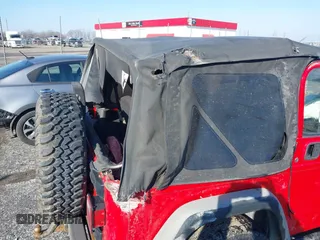 2005 Jeep Wrangler X with VIN 1J4FA39S95P385581, listed as a IAAI auction lot 41333338 with 150,010 mi miles and . Bid and sale history available at DreamBid. Image 13.