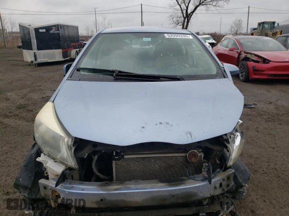 2012 Toyota Yaris L with VIN JTDKTUD33CD517298, listed as a Copart auction lot 52099335 with Not Provided miles and Salvage Title. Bid and sale history available at DreamBid. Image 5.
