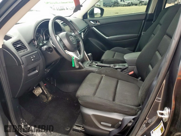 2014 Mazda CX-5 Touring z VIN JM3KE2CY7E0308580, wystawiony jako Copart lot #60565835 z przebiegiem 92 708 mil mil oraz Szkoda całkowita • Salvage title. Historia ofert i sprzedaży dostępna na DreamBid. Obrazek 7.