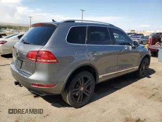 2013 Volkswagen Touareg Sport с VIN WVGEP9BP0DD010408, выставлен на аукционе Copart как лот 75854084 с пробегом 159 863 миль миль и Списание • Salvage title. История ставок и продаж доступна на DreamBid. Изображение 3.