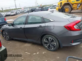 2017 Honda Civic EX-T with VIN 19XFC1F34HE014334, listed as a IAAI auction lot 42009311 with 124,717 mi miles. Bid and sale history available at carsss.com. Image 14.
