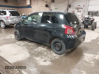 2008 Toyota Yaris with VIN JTDJT923285196299, listed as a IAAI auction lot 42152850 with 214,238 mi miles. Bid and sale history available at carsss.com. Image 3.