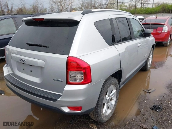 2011 Jeep Compass with VIN 1J4NF1FB6BD283741, listed as a IAAI auction lot 41948515 with 105,415 mi miles. Bid and sale history available at carsss.com. Image 4.