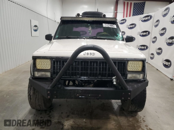 1996 Jeep Cherokee Sport with VIN 1J4FJ68S5TL235927, listed as a Copart auction lot 68942174 with 238,619 mi miles and Clean Title. Bid and sale history available at carsss.com. Image 5.