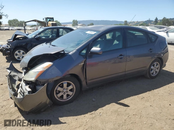 2007 Toyota Prius with VIN JTDKB20U173202615, listed as a Copart auction lot 61873945 with 219,911 mi miles and Salvage title. Bid and sale history available at DreamBid. Image 1.