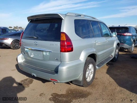 2004 Lexus GX 470 with VIN JTJBT20X340025955, listed as a IAAI auction lot 41673289 with 106,701 mi miles. Bid and sale history available at carsss.com. Image 4.