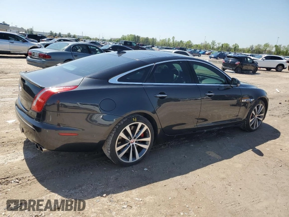 2013 Jaguar XJ with VIN SAJWA3HE9DMV49768, listed as a Copart auction lot 50339955 with 56,841 mi miles and Salvage Title. Bid and sale history available at DreamBid. Image 3.
