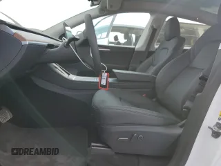 2025 Tesla Model Y Long Range with VIN 7SAYGDED6SF271931, listed as a Copart auction lot 43376015 with 261 mi miles and Salvage Title. Bid and sale history available at DreamBid. Image 7.