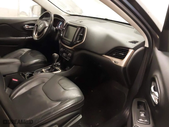 2014 Jeep Cherokee Limited with VIN 1C4PJMDSXEW317089, listed as a IAAI auction lot 41234563 with 127,153 mi miles. Bid and sale history available at carsss.com. Image 5.