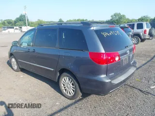 2008 Toyota Sienna XLE with VIN 5TDBK22C58S017861, listed as a IAAI auction lot 42604679 with 144,934 mi miles and . Bid and sale history available at DreamBid. Image 3.