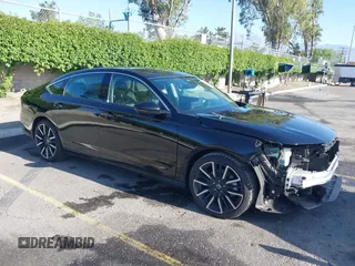2025 Honda Accord Touring with VIN 1HGCY2F80SA016356, listed as a IAAI auction lot 42299045 with 14,326 mi miles and . Bid and sale history available at DreamBid. Image 1.