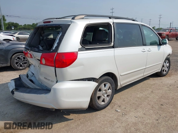 2010 Toyota Sienna XLE z VIN 5TDYK4CC2AS325645, wystawiony jako IAAI lot #42145624 z przebiegiem 202 868 mil mil oraz . Historia ofert i sprzedaży dostępna na DreamBid. Obrazek 4.