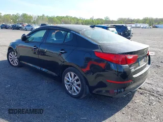 2015 Kia Optima LX with VIN KNAGM4A71F5630673, listed as a IAAI auction lot 42106584 with 245,005 mi miles and . Bid and sale history available at carsss.com. Image 3.