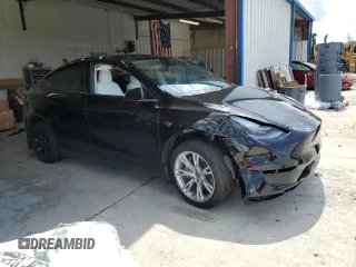 2024 Tesla Model Y Long Range z VIN 7SAYGDEEXRF072397, wystawiony jako Copart lot #61157535 z przebiegiem Nie podano mil oraz Szkoda całkowita • Salvage title. Historia ofert i sprzedaży dostępna na DreamBid. Obrazek 4.