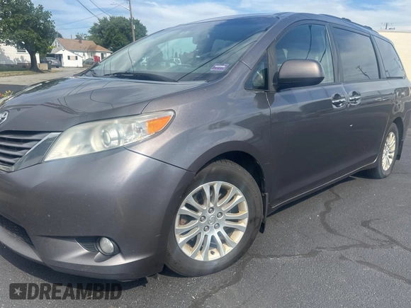 2015 Toyota Sienna XLE with VIN 5TDYK3DC5FS567460, listed as a Copart auction lot 63311295 with 296,433 mi miles and Clean title. Bid and sale history available at DreamBid. Image 2.