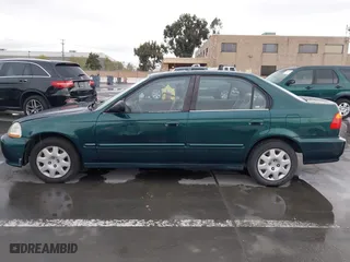 1999 Honda Civic VP with VIN 2HGEJ6618XH579736, listed as a IAAI auction lot 41912296 with 268,631 mi miles. Bid and sale history available at carsss.com. Image 15.
