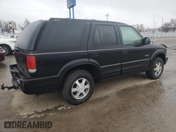 2000 Oldsmobile Bravada z VIN 1GHDT13W5Y2311819, wystawiony jako Copart lot #44839145 z przebiegiem 163 427 mil mil oraz Tytuł czysty. Historia ofert i sprzedaży dostępna na DreamBid. Obrazek 3.
