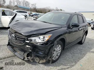 2016 Mazda CX-5 Touring with VIN JM3KE2CY1G0654434, listed as a Copart auction lot 48974115 with 83,977 mi miles and Salvage Title. Bid and sale history available at carsss.com. Image 1.