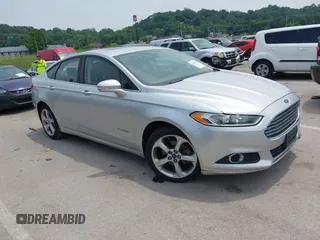2013 Ford Fusion SE Hybrid z VIN 3FA6P0LU7DR267300, wystawiony jako IAAI lot #42376940 z przebiegiem 148 298 mil mil oraz . Historia ofert i sprzedaży dostępna na DreamBid. Obrazek 1.