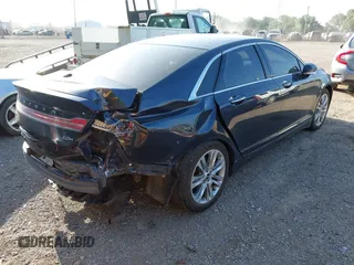 2014 Lincoln MKZ Hybrid z VIN 3LN6L2LU6ER803720, wystawiony jako IAAI lot #42560627 z przebiegiem 120 795 mil mil oraz . Historia ofert i sprzedaży dostępna na DreamBid. Obrazek 4.
