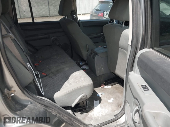2007 Jeep Commander Sport z VIN 1J8HG48P87C647870, wystawiony jako IAAI lot #42185954 z przebiegiem 269 402 mil mil oraz . Historia ofert i sprzedaży dostępna na DreamBid. Obrazek 8.
