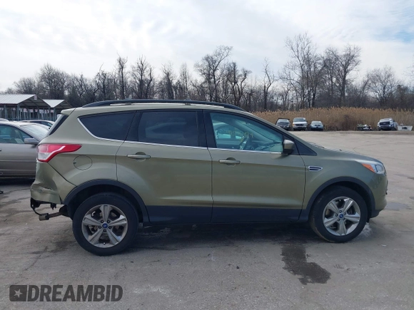 2013 Ford Escape SE with VIN 1FMCU9GX1DUB69236, listed as a IAAI auction lot 41575494 with 122,075 mi miles and . Bid and sale history available at DreamBid. Image 13.