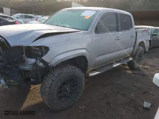 2016 Toyota Tacoma SR with VIN 5TFCZ5ANXGX037133, listed as a IAAI auction lot 41312910 with 153,157 mi miles. Bid and sale history available at carsss.com. Image 2.