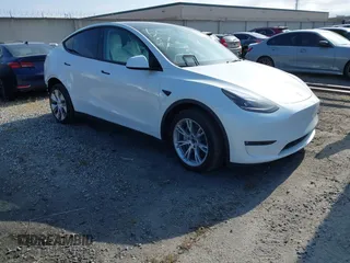 2024 Tesla Model Y with VIN 7SAYGDED2RF017448, listed as a IAAI auction lot 41597056 with 9,702 mi miles and . Bid and sale history available at DreamBid. Image 1.
