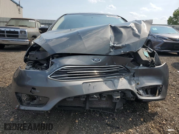 2018 Ford Focus Titanium z VIN 1FADP3N20JL271719, wystawiony jako Copart lot #60784755 z przebiegiem 116 118 mil mil oraz Szkoda całkowita • Salvage title. Historia ofert i sprzedaży dostępna na DreamBid. Obrazek 5.